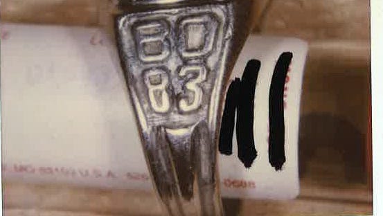 A class ring found the body of a Latino man found in the All-American Canal on May 15, 2000. The ring is from the class of 1980-83, and includes the words “ESC.TEC.COM.PROF.ABELINO BOLLANOS.” Photo from John Doe Case #00-066.