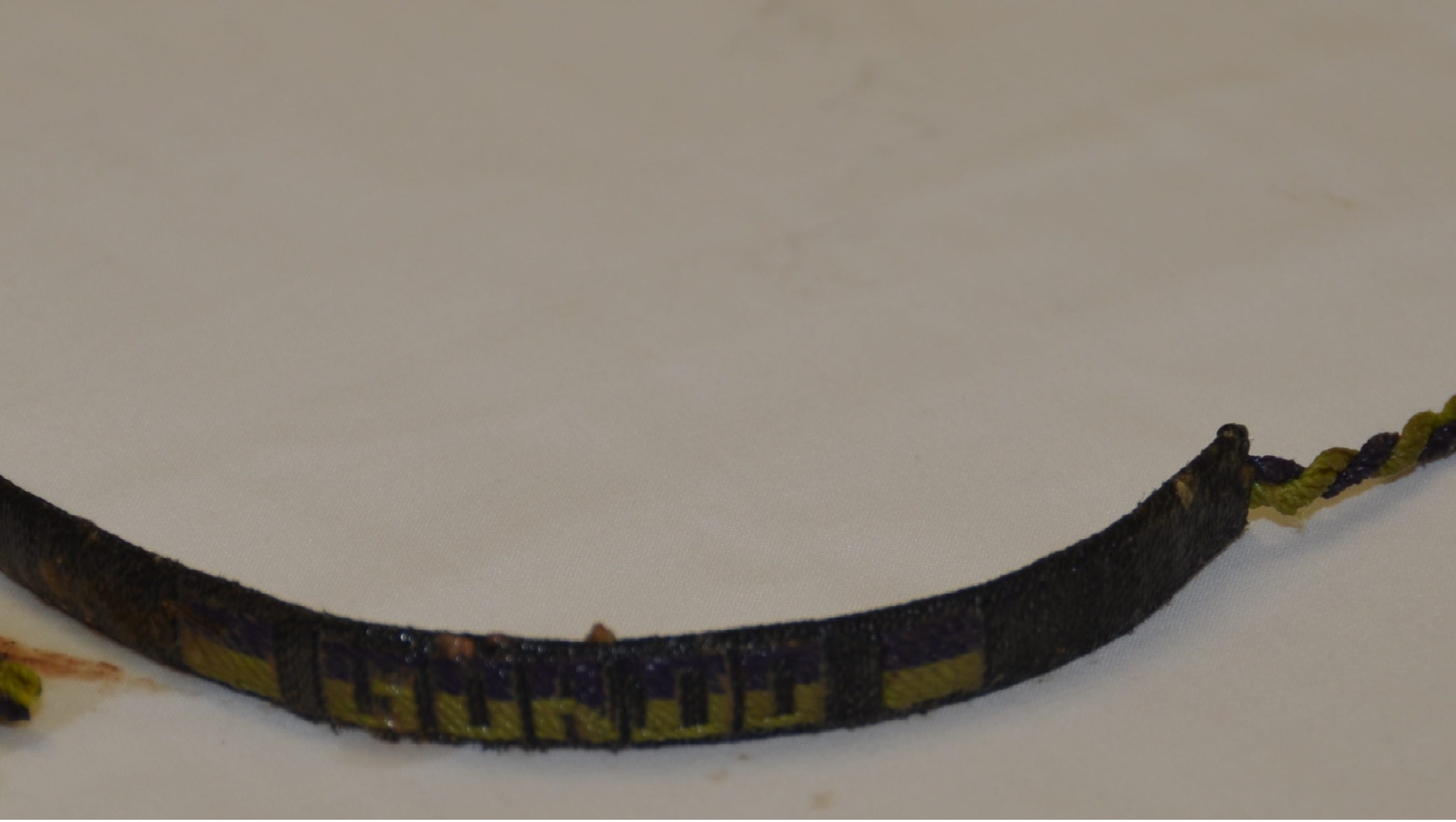 A woven bracelet that reads “Gordo” found with the body of a Latino man located in the All-American Canal on July 28, 2015. Photo from John Doe Case #15-130.