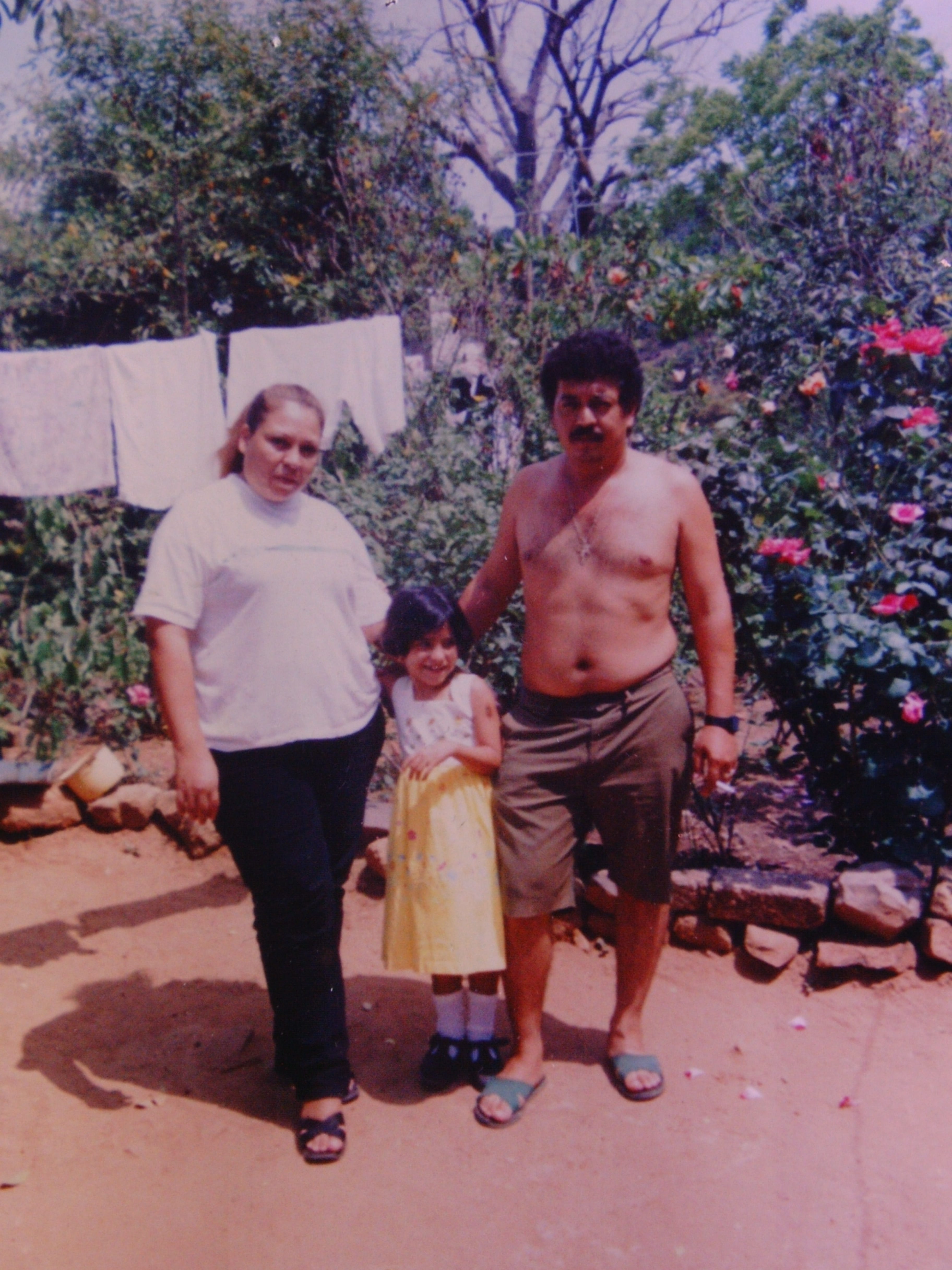 A photo of a man, a woman and a girl found on the body of a Latino man located in field in Seeley, CA on July 7, 2000. The deceased man appears to be the guy in the photo. His name may be Rigoberto Chabes Gomes. Photo from John Doe Case #00-108.