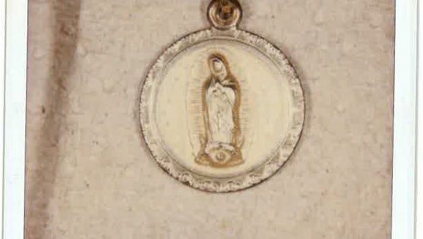 A pendant found with the body of a Latino man in the All-American Canal on May 10, 2000. Photo from John Doe Case #00-063.